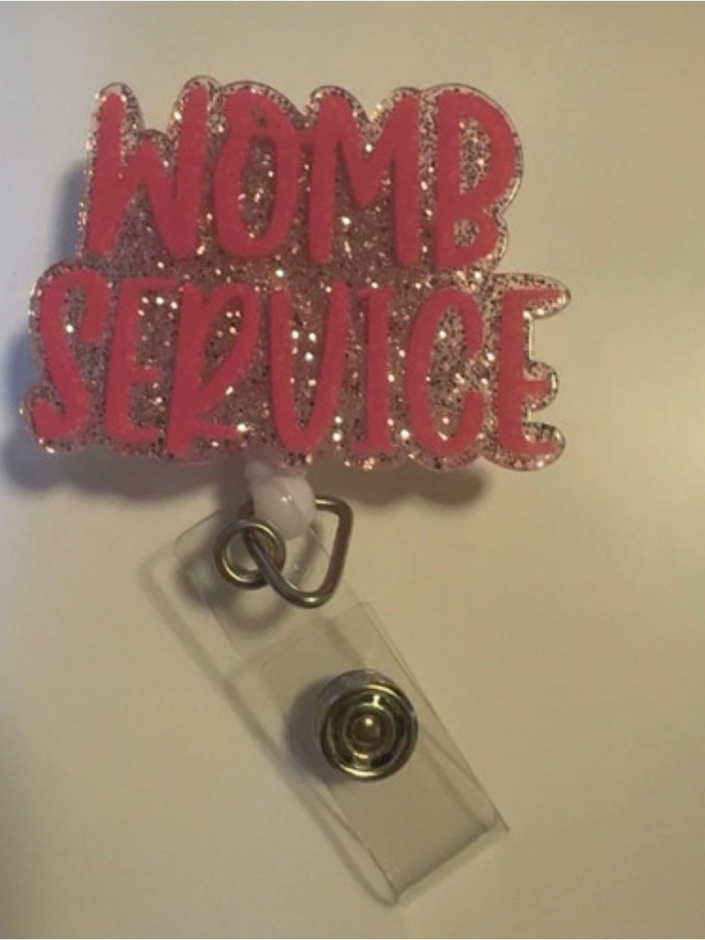 Pink "WOMB SERVICE" Glitter Badge Reel - Women Accessories